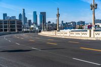 Cityscape of Los Angeles: Asphalt Road Under Cloudy Sky