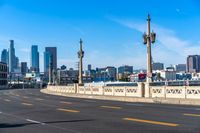 Cityscape of Los Angeles: Asphalt Road Under Cloudy Sky