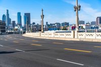 Cityscape of Los Angeles: Asphalt Road Under Cloudy Sky