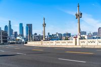 Cityscape of Los Angeles: Asphalt Road Under Cloudy Sky