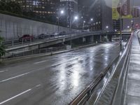 Cityscape of Los Angeles at Night with Rain-Soaked Streets