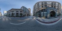 an image of a street in the mirror view of an object and buildings surrounding it