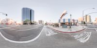 a skateboarder is doing tricks in the city on a street with traffic lights