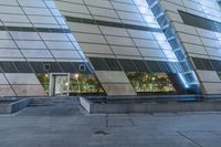 a building has many different angles and shapes on it as a reflection in the windows