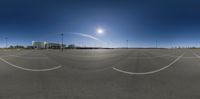 a panoramic image shows the airport in the morning sun, and a full moon seen through a lens