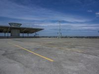 the large structure sits on top of the concrete parking lot in the center of the photograph