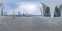 a view of some buildings from a 360 - ray mirror of it taken in the sky