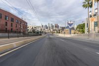 the view from a moving vehicle while driving along a city street in the daytime time