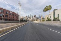 the view from a moving vehicle while driving along a city street in the daytime time