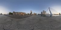 this is an image of a fisheye lens of a city square with skyscrapers