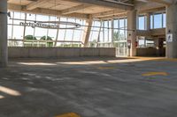 an empty parking lot in a large building with windows in front of it with a sign that reads huntington