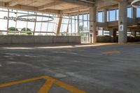 an empty parking lot in a large building with windows in front of it with a sign that reads huntington