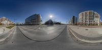 street view showing the sun and the buildings in the background and a blue sky,