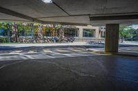 the view of the parking lot in the building from under, showing it's asphalt