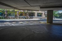 the view of the parking lot in the building from under, showing it's asphalt