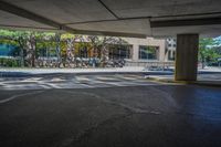 the view of the parking lot in the building from under, showing it's asphalt