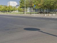 a red stop sign sitting next to a green light on the side of a road