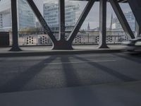 an image of a view out a window on the bridge, with traffic driving along it