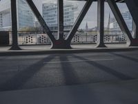 an image of a view out a window on the bridge, with traffic driving along it