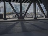 an image of a view out a window on the bridge, with traffic driving along it