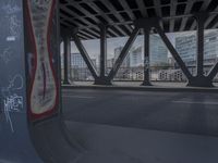 an image of a view out a window on the bridge, with traffic driving along it