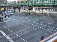 the view out the window on the road from the passenger platform in the city, people walking on the sidewalk, and cars