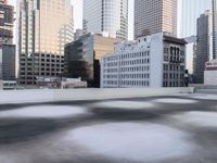 a view of the city through a roof deck overlooking the city's buildings on a clear day
