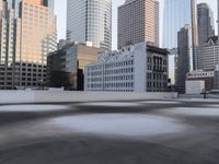 a view of the city through a roof deck overlooking the city's buildings on a clear day
