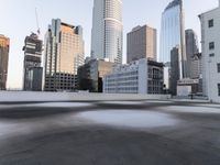 a view of the city through a roof deck overlooking the city's buildings on a clear day