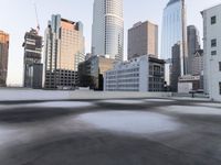 a view of the city through a roof deck overlooking the city's buildings on a clear day
