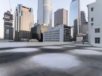 a view of the city through a roof deck overlooking the city's buildings on a clear day