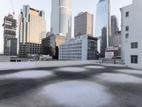 a view of the city through a roof deck overlooking the city's buildings on a clear day
