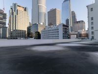 a view of the city through a roof deck overlooking the city's buildings on a clear day