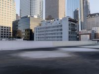 a view of the city through a roof deck overlooking the city's buildings on a clear day