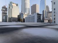 a view of the city through a roof deck overlooking the city's buildings on a clear day