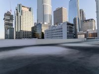 a view of the city through a roof deck overlooking the city's buildings on a clear day