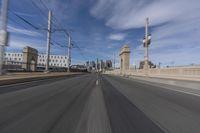 the view from the windshield of a vehicle moving on the highway through the city buildings