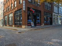 a brick building that has many signs on it and windows in the windows with a red, white and blue sign on it