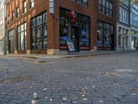 a brick building that has many signs on it and windows in the windows with a red, white and blue sign on it