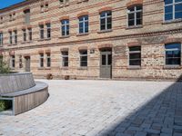 an old building has cobbles and stone walkways for visitors to see and play with