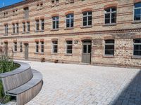 an old building has cobbles and stone walkways for visitors to see and play with