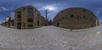 a view of an alley through a fish eye lens, and an image of building