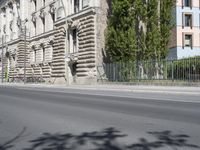 there is a large building on the corner of this street corner on a sunny day