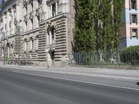 there is a large building on the corner of this street corner on a sunny day