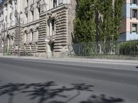 there is a large building on the corner of this street corner on a sunny day