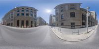 a 360 - degree photo of two curved streets with the buildings in the background and the building that is at the end