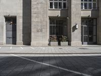 a parking space for traffic in front of a building with multiple windows and a parking space