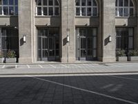 a parking space for traffic in front of a building with multiple windows and a parking space