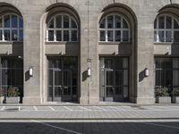 a parking space for traffic in front of a building with multiple windows and a parking space