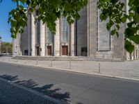 an entrance of a building with large columns and doors that spell out the word voltege